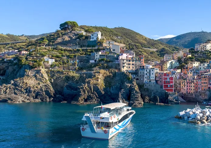 Passenger ferry sailing along the Cinque Terre coastline